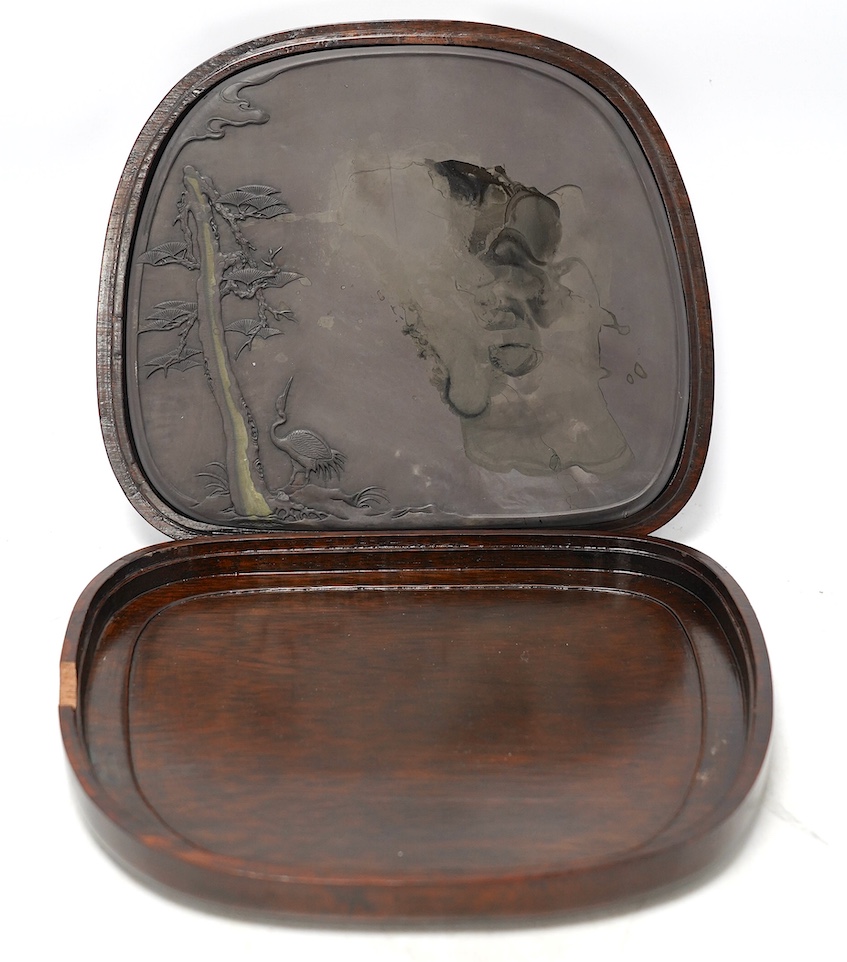 A hardwood cased Japanese ink stone, 20.5 x 24cm. Condition - good